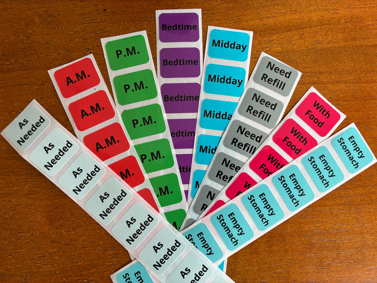 Health, Handled medication sticker refills with color-coded labels for medication times, food instructions, refills, and as-needed use.