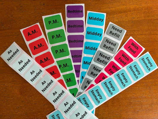 Health, Handled medication sticker refills with color-coded labels for medication times, food instructions, refills, and as-needed use.